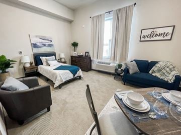 Columbus apartment for rent - a living room and bedroom with a table and chairs and a bed