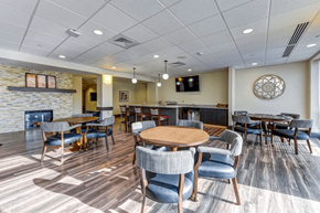 Columbus apartment for rent - a dining room with tables and chairs and a fireplace