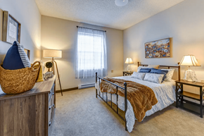 Columbus apartment for rent - a bedroom with a bed and a window