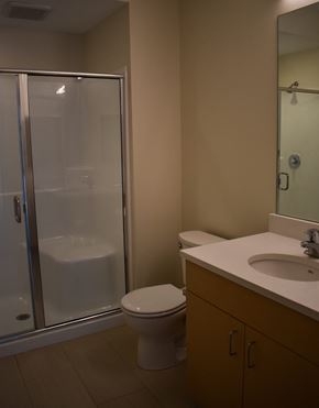 Cleveland apartment for rent - A bathroom with a toilet, sink, and shower.
