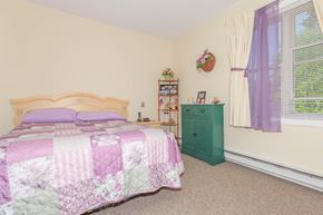 Jonesport apartment for rent - a bedroom with a bed and a green dresser