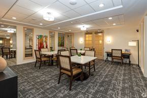 Aurora apartment for rent - game room with tables and chairs