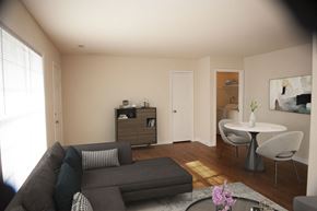 Newport News apartment for rent - a living room and dining room with a couch and a table