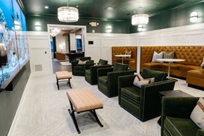 Columbus apartment for rent - a lounge area with couches and chairs and tables