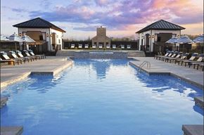 Columbus apartment for rent - a swimming pool with chairs and umbrellas at a resort