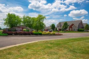 Springboro apartment for rent - a street with houses and trees and a road