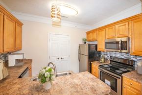 Springboro apartment for rent - a kitchen with stainless steel appliances and a counter top