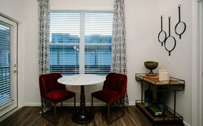 Columbus apartment for rent - a dining room with a table and chairs and a window