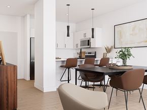 Dieppe apartment for rent - A modern kitchen with a dining table and chairs.