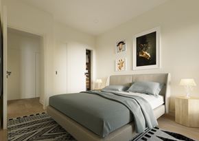 Dieppe apartment for rent - A bedroom with a bed, a lamp, and pictures on the wall.
