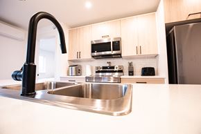 Dieppe townhouse for rent - a kitchen with a sink and a counter top