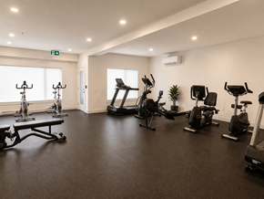 Dieppe apartment for rent - A gym with a variety of exercise equipment including treadmills, stationary bikes, and weight machines.