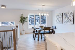 Dieppe townhouse for rent - A dining room with a table set for four.