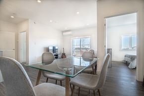 Dieppe townhouse for rent - a dining room with a glass table and chairs