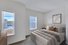 Denver apartment for rent - bedroom with two large windows, bedroom and dresser