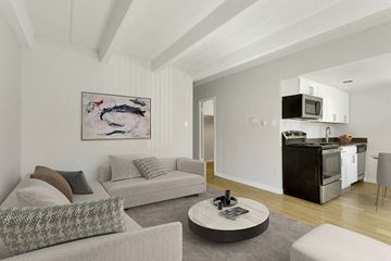 Denver apartment for rent - a living room with a couch and a table