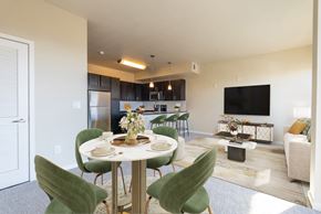 Denver apartment for rent - A modern dining room with a round table set for four.