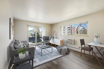 Denver apartment for rent - a living room with a couch and a table