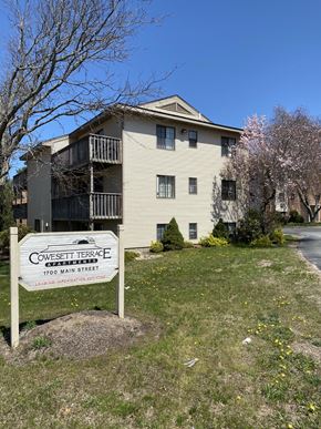 West Warwick apartment for rent - an apartment building with a sign in front of it