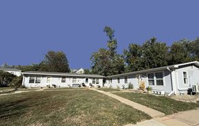 Glasford apartment for rent - A row of houses with a clear blue sky above.