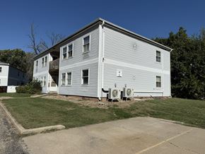 Glasford apartment for rent - A two-story house with a garage on the side.
