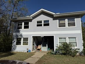 Chillicothe apartment for rent - A house with a grey siding and a white roof.