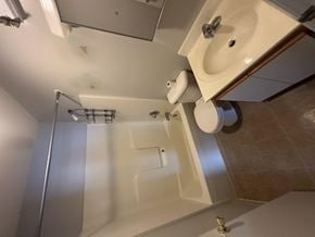 West Liberty townhouse for rent - A white sink is mounted on a wall above a toilet.