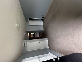 West Liberty townhouse for rent - A room with a white door and a window with blinds.