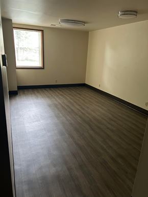 Harrisburg apartment for rent - A room with a window and a wooden floor.