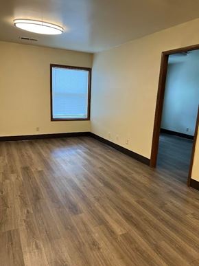 Harrisburg apartment for rent - A room with wooden flooring and a window.