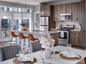 Little Falls apartment for rent - A modern kitchen with a dining table set for two.