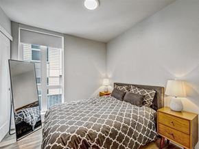 Seattle apartment for rent - a bedroom with a bed and a mirror