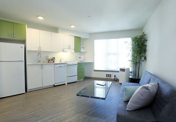 Seattle apartment for rent - a living room with a couch and a table