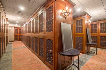 A large room filled with wooden cabinets and a large screen television