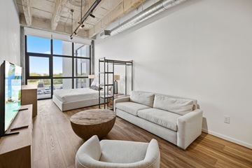 Miami apartment for rent - A living room with a pool table and a couch.