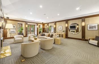 A large living room with couches and chairs