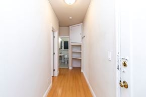 Berkeley apartment for rent - A hallway with a white door and a white wall.