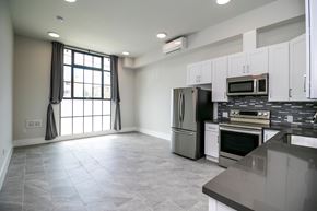 Berkeley apartment for rent - A kitchen with a refrigerator, oven, and microwave.