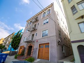 Berkeley apartment for rent - A building with a brown door and a fire escape.