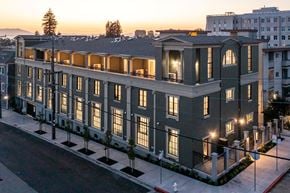 Berkeley apartment for rent - A large, well-lit building with a balcony on the second floor.