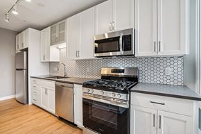 Golden Valley apartment for rent - Kitchen with white cabinetry and stove top oven at Arcata Apartments, Golden Valley, MN, 55416