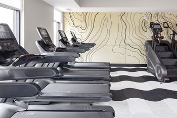 Fitness center with high-end precor workout equipment and separate group fitness studio