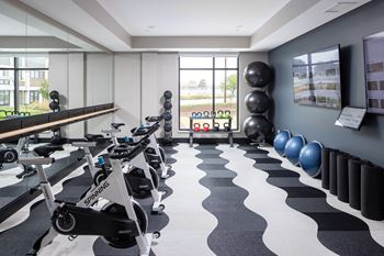 Fitness center with high-end precor workout equipment and separate group fitness studio