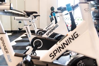 Fitness center with high-end precor workout equipment and separate group fitness studio