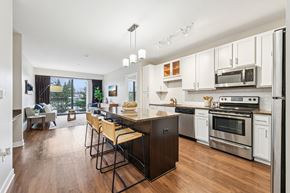 Eden Prairie apartment for rent - A modern kitchen with a dining table and chairs.