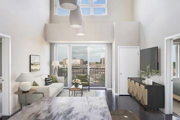 Edina apartment for rent - a living room with a couch and a table and a large window