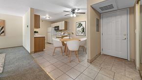 Rapid City apartment for rent - a dining room with a table and chairs and a kitchen
