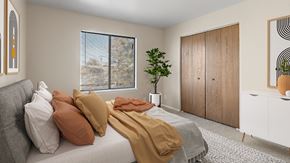 Billings apartment for rent - a bedroom with a bed with pillows and blankets on it