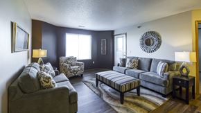 Bismarck apartment for rent - a living room with couches and chairs and a table