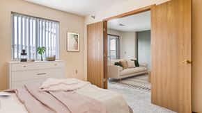 Billings apartment for rent - a bedroom with a bed and a door to a living room